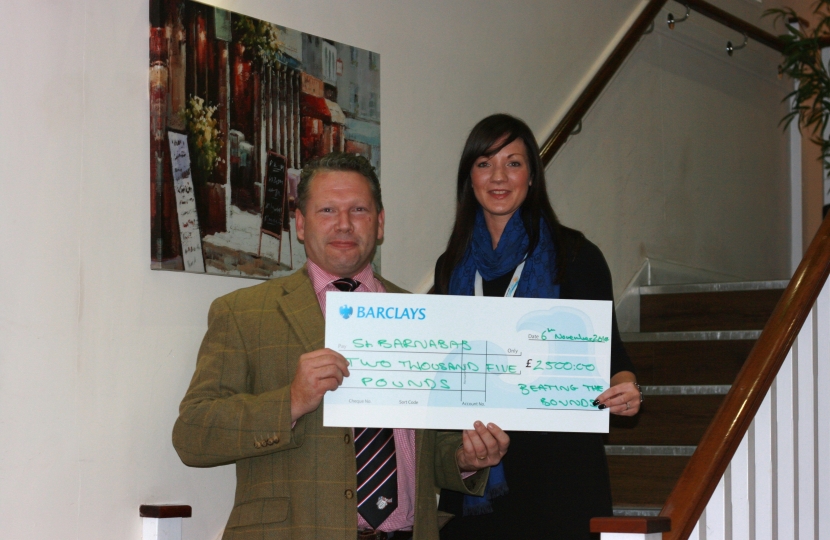Presenting a cheque to St. Barnabas Hospice