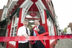 Karl cutting the ribbon at the new-look Bailgate Post Office